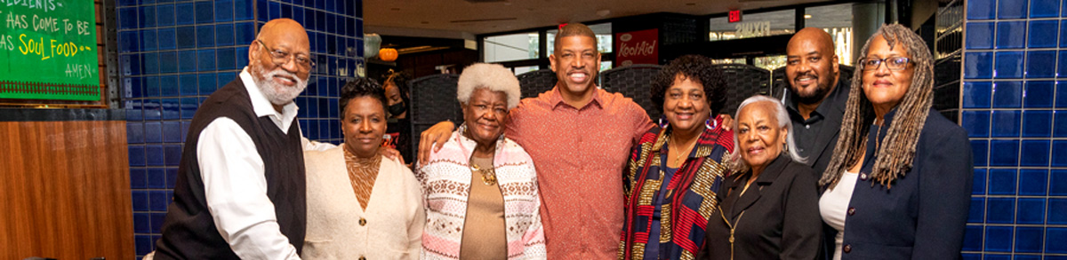 Dr. Shirley Weber with a group of people inside a restaurant