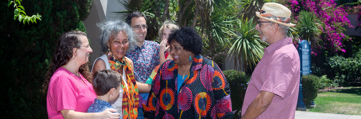 Dr. Shirley Weber speaking to a group of people outdoors